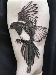 black and grey bird tattoo