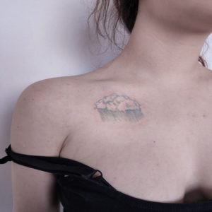 Blur Cloud Tattoo On The Upper Part Of The Chest