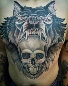 wolf and skull chest tattoo