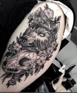 wolf eating skull tattoo