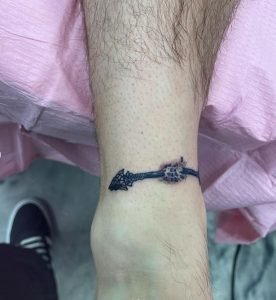 Small Broken Arrow Leg Tattoo 