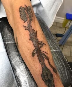 Broken Arrow Fixed Tattoo On Arm 