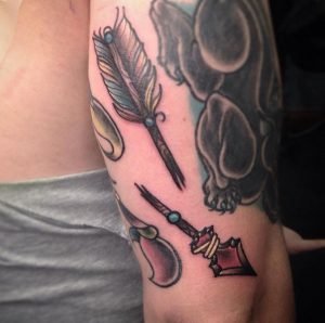 Broken Arrow On Back Upper Arm Tattoo Design