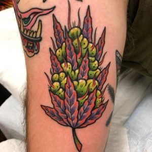 Pot leaf tattoo in Hand