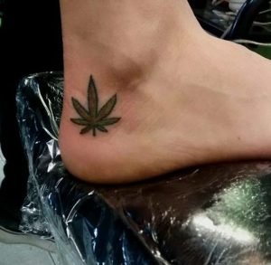 Pot Leaf Tattoo Art On Foot Hill 